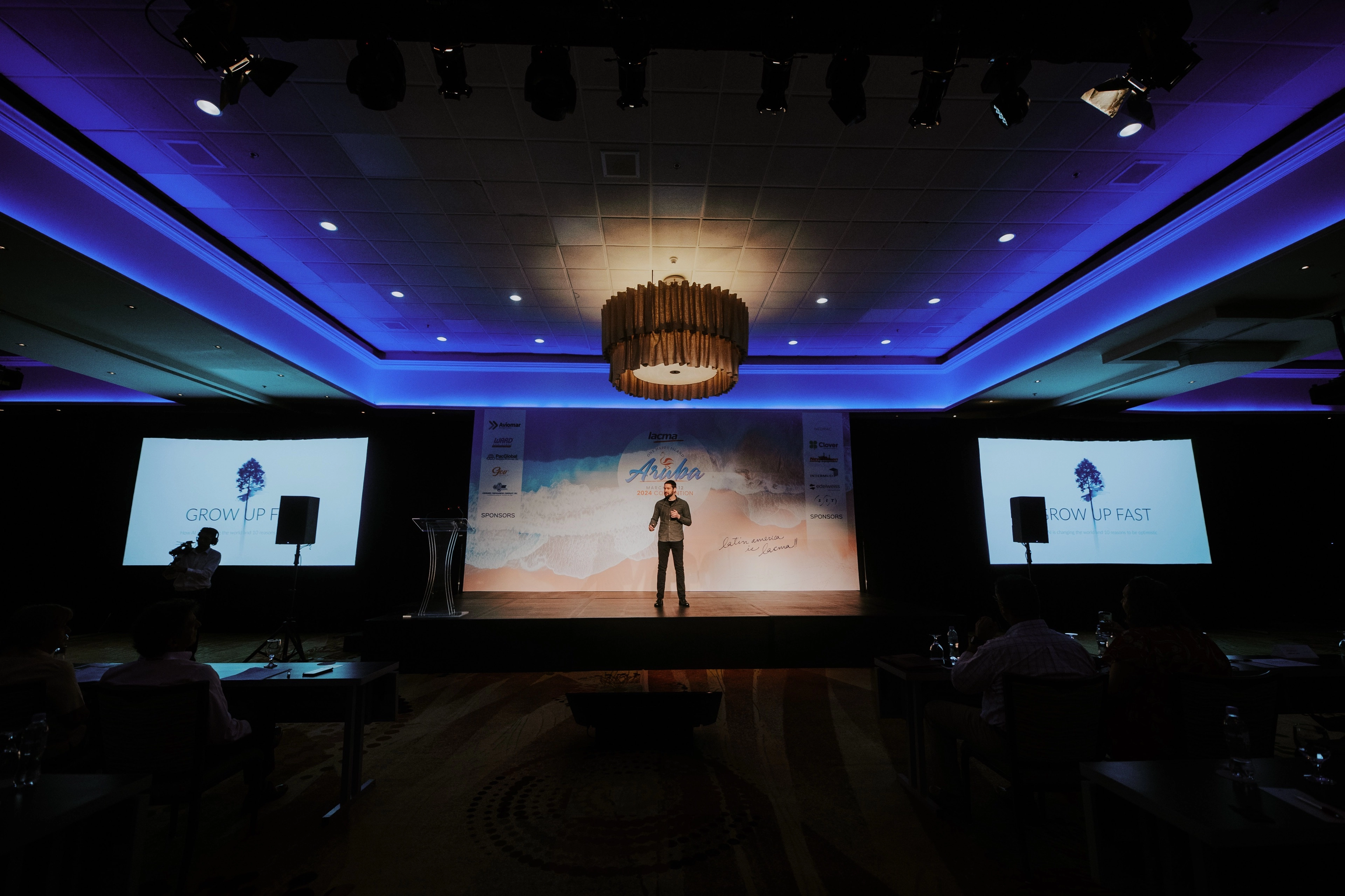 Speaker presenting on stage at LACMA